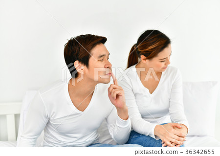 A couple lover is upset about something in the bedroom. A couple lover is upset about something in the bedroom. 36342655