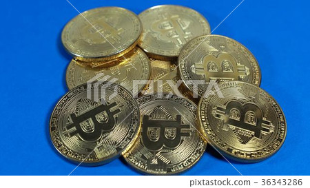 several coins of gold bitcoins on dark background several coins of gold bitcoins on dark background 36343286