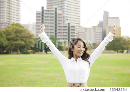 A young woman walking in the park 36348264