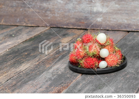 rambutan sweet fruit in plate on wood background rambutan sweet fruit in plate on wood background 36350093