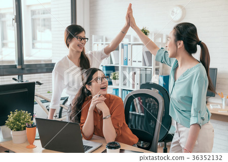two young business people giving high-five 36352132