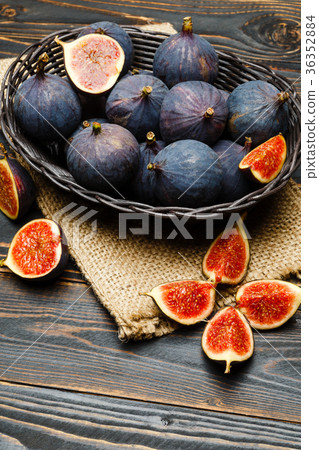 Fig isolated on wooden background Fig isolated on wooden background 36352884
