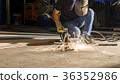 worker welding metal, focus on flashlight 36352986