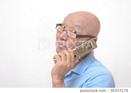 Senior speaking with smile on mobile phone Senior speaking with smile on mobile phone 36353179