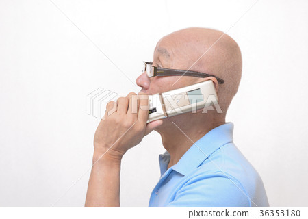 Senior speaking with smile on mobile phone Senior speaking with smile on mobile phone 36353180