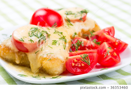 chicken chop under melted cheese 36353460