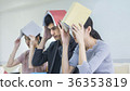 people student read book and hold over head 36353819