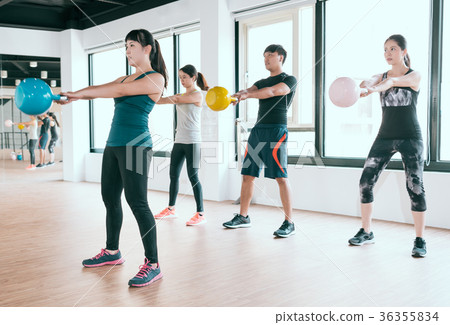 player exercise with kettlebell lifting up 36355834