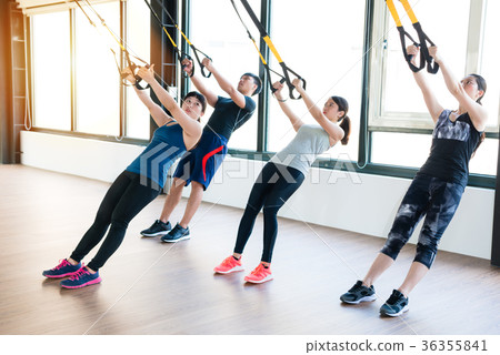 team of Asian people training with TRX 36355841
