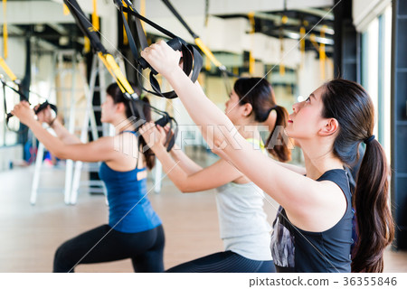 beautiful Asian girl learning using TRX 36355846