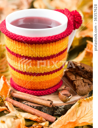 Fruit tea in a cup in a knitted cover Fruit tea in a cup in a knitted cover 36357628