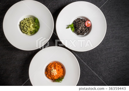 Three risotto (risotto (squid ink, tomato, basil) Three risotto (risotto (squid ink, tomato, basil) 36359443