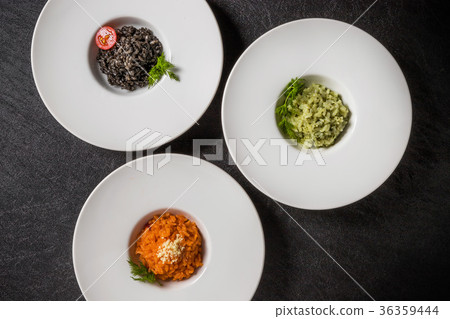 Three risotto (risotto (squid ink, tomato, basil) Three risotto (risotto (squid ink, tomato, basil) 36359444