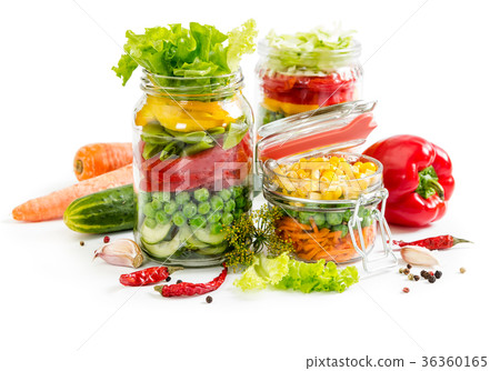 Colorful vegetables in glass jars 36360165