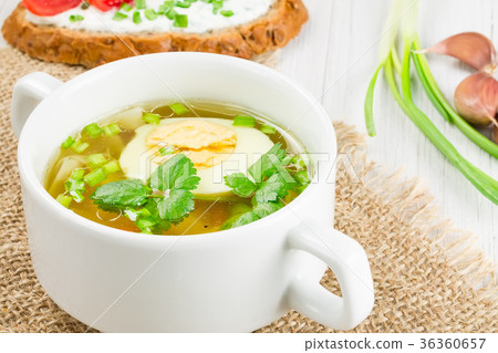 Hot soup with boiled egg   36360657