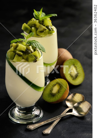Italian dessert -pannacotta with kiwu fruit. 36362402