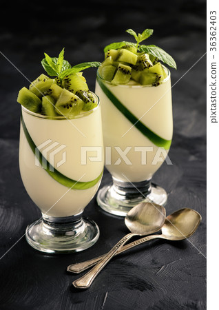 Italian dessert -pannacotta with kiwu fruit. 36362403