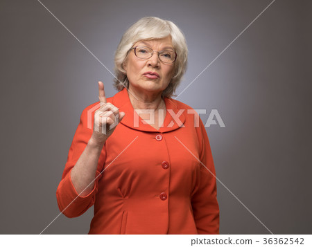Senior lady points finger up Senior lady points finger up 36362542