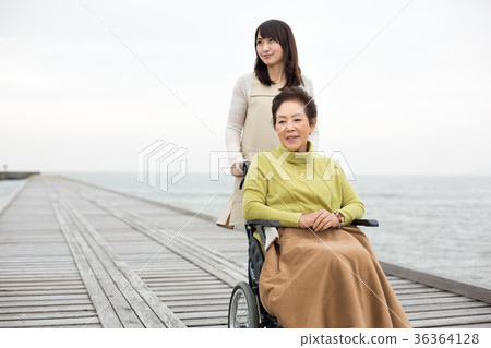 Care wheelchair mother and daughter Care wheelchair mother and daughter 36364128