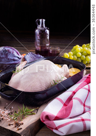 Raw young duck on a roaster 36364448