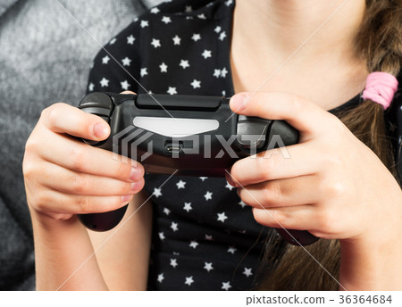 Child girl is playing video games Child girl is playing video games 36364684