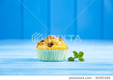 Fresh muffins with nuts and chocolate 36365088