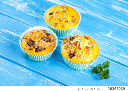 Fresh muffins with nuts and chocolate 36365089