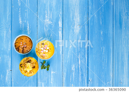 Fresh muffins with nuts and chocolate 36365090