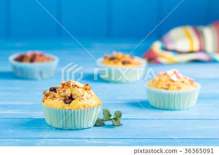 Fresh muffins with nuts and chocolate 36365091