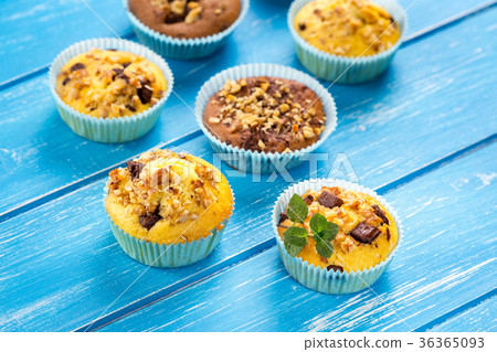 Fresh muffins with nuts and chocolate 36365093