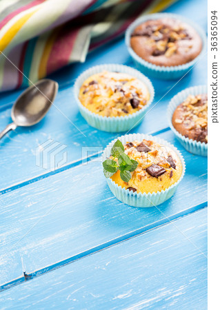 Fresh muffins with nuts and chocolate Fresh muffins with nuts and chocolate 36365094