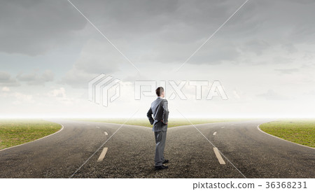 Businessman choosing his way 36368231