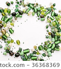 green glass beads shaped into off center garland 36368369
