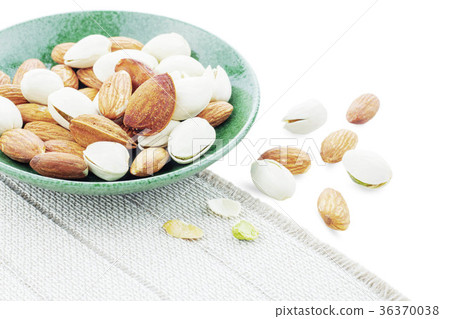 Many almonds on a plate. Many almonds on a plate. 36370038