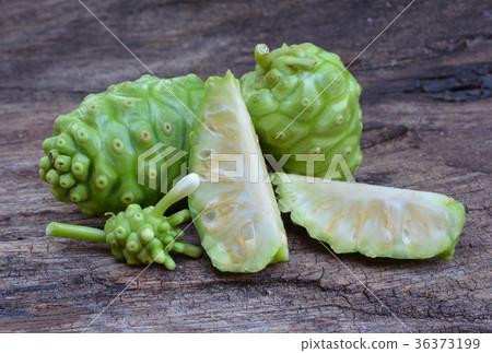 noni fruit on wood noni fruit on wood 36373199