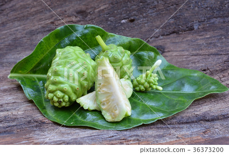 noni fruit on wood 36373200