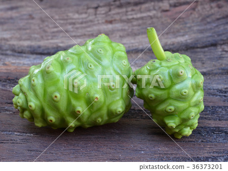 noni fruit on wood 36373201