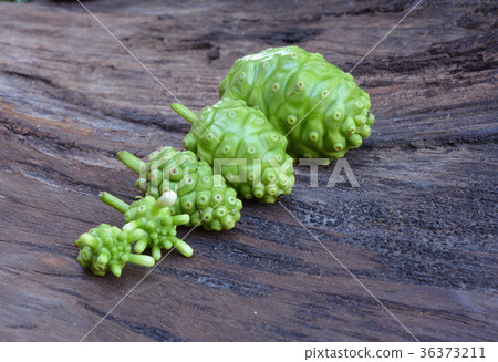 noni fruit on wood 36373211