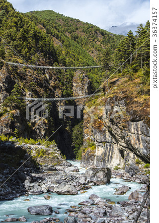 Everest highway suspension bridge and river Dude Kosi 36374157