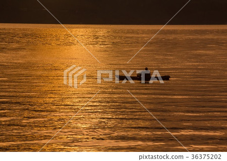 Sunset Sunrise with reflections at Lake Toba,   36375202