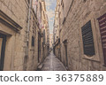 Narrow aisle between old building in Dubrovnik. 36375889