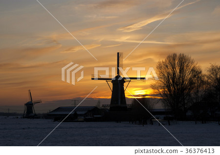 Windmills at sunset Windmills at sunset 36376413