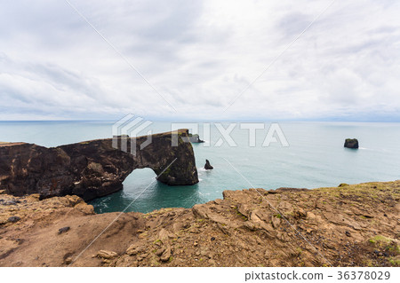 volcanic arch on Dyrholaey promontory in Iceland volcanic arch on Dyrholaey promontory in Iceland 36378029