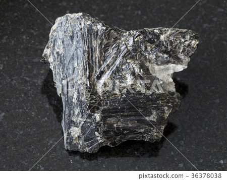 raw Gedrite stone on dark background 36378038