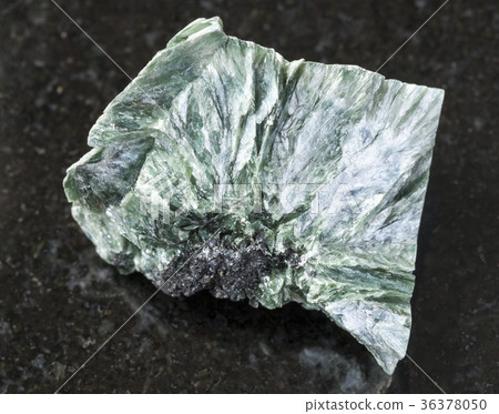 raw clinochlore stone on dark background 36378050