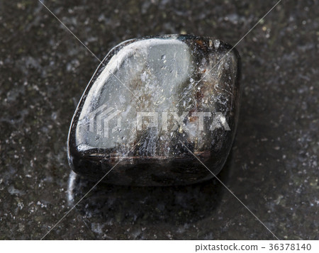 tumbled anthophyllite gemstone on dark tumbled anthophyllite gemstone on dark 36378140