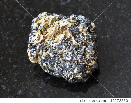 raw Perovskite stone on dark background raw Perovskite stone on dark background 36378280