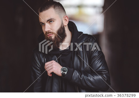 Modern young bearded man in black style clothes 36378299