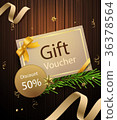premium gift voucher on wooden background 36378564