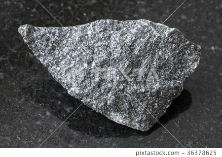raw dolerite stone on dark background 36378625